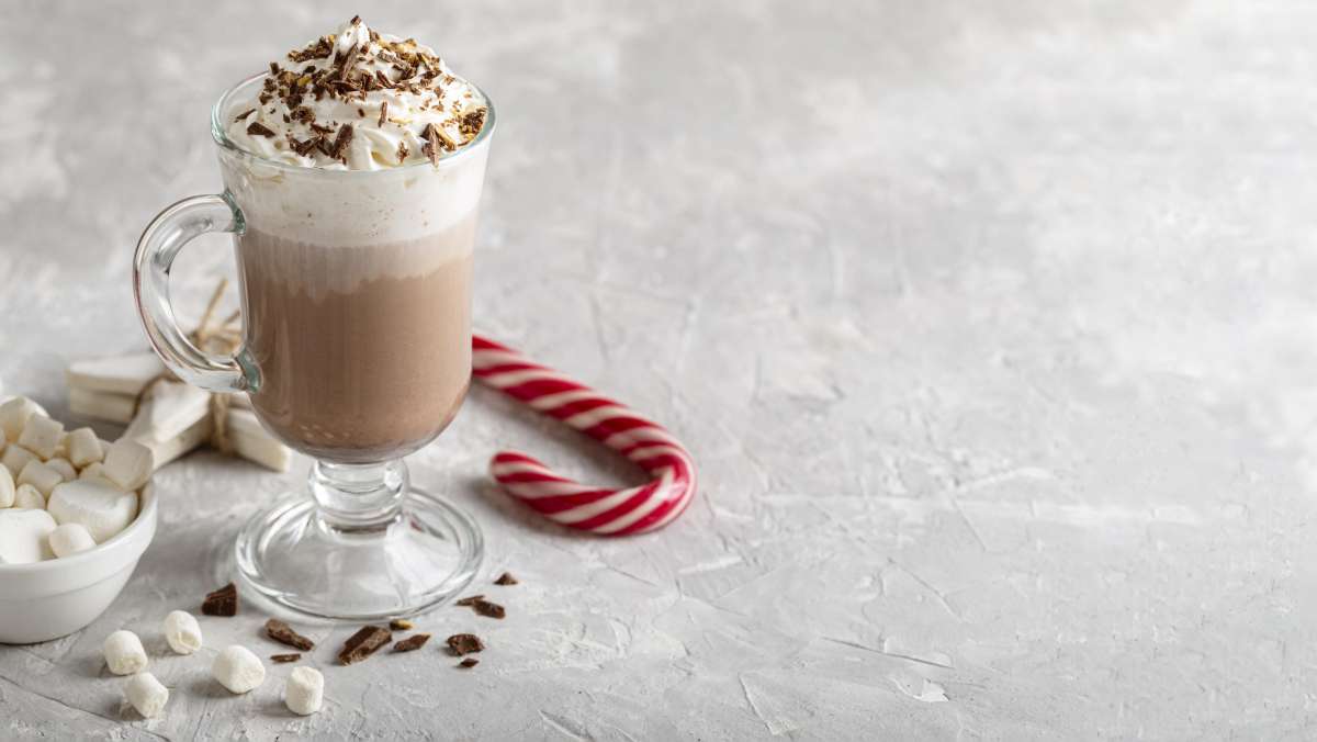 Carolling with peppermint hot chocolate  with whipped cream